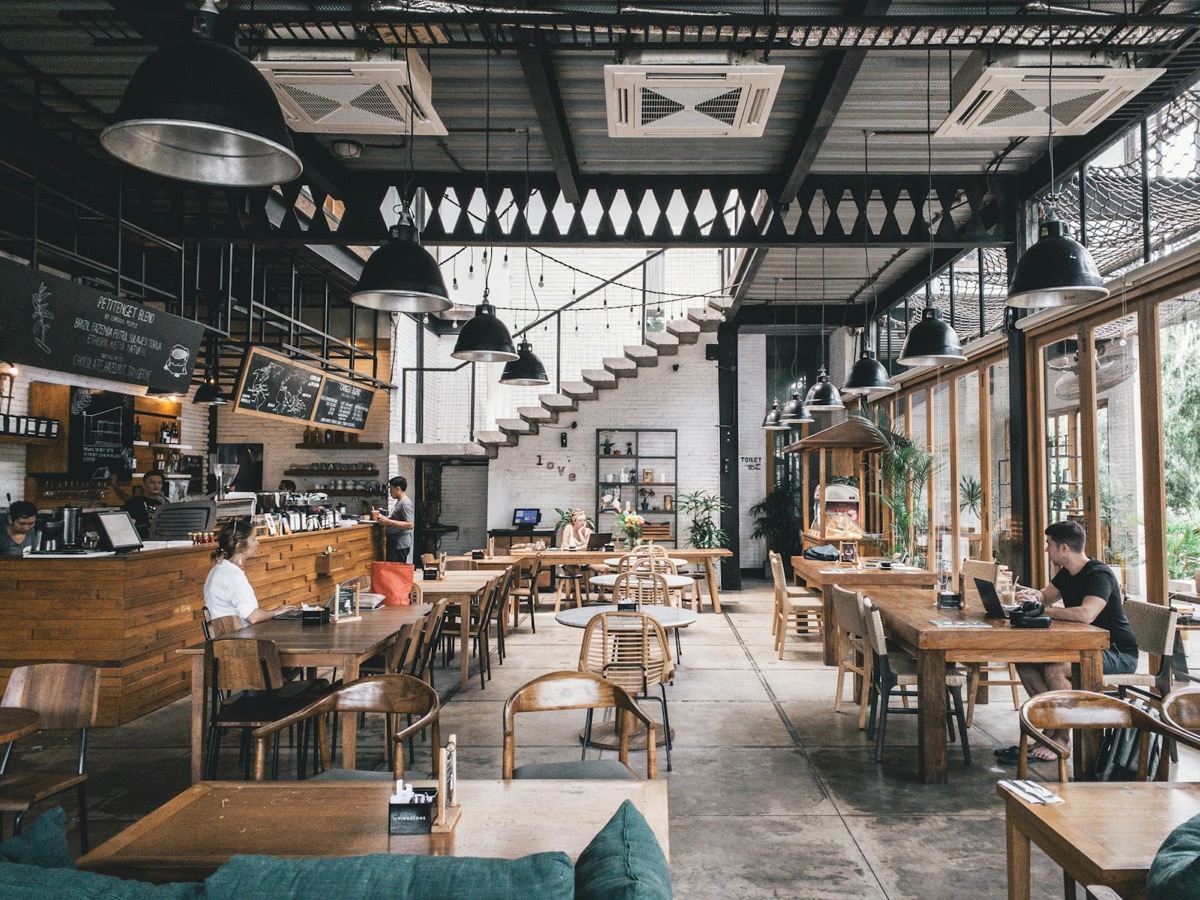 Restaurant dining room with diners at tables
