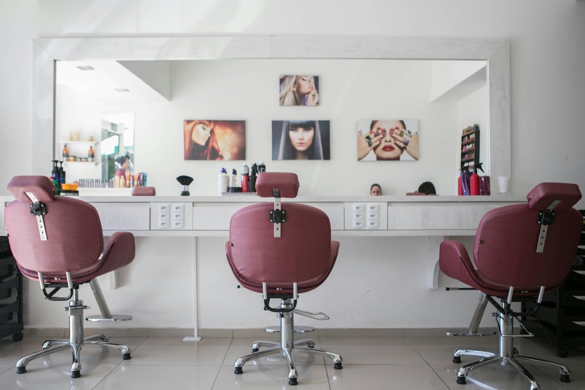 Salon stylist working with a client